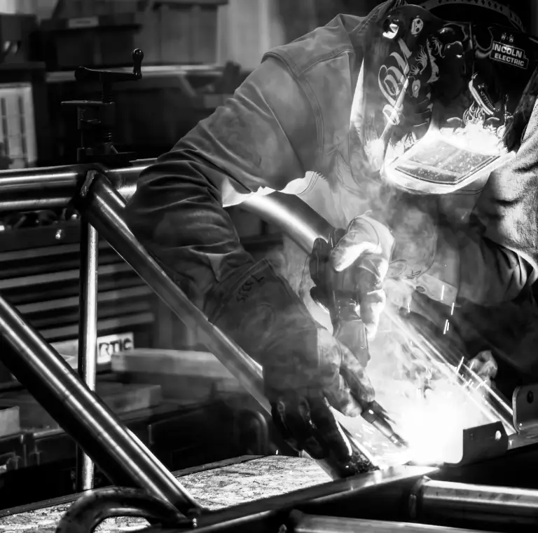 a person welding a piece of metal