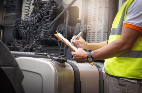 Truck Driver in High-Visibility Vest with Clipboard