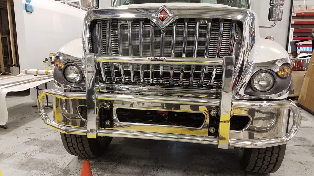 Chrome International Truck in a Garage with Chrome RIGGUARD Grille Guard