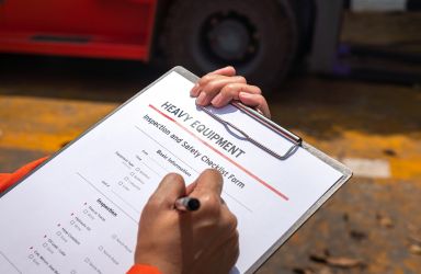 Man Filling Out Safety Checklist Form