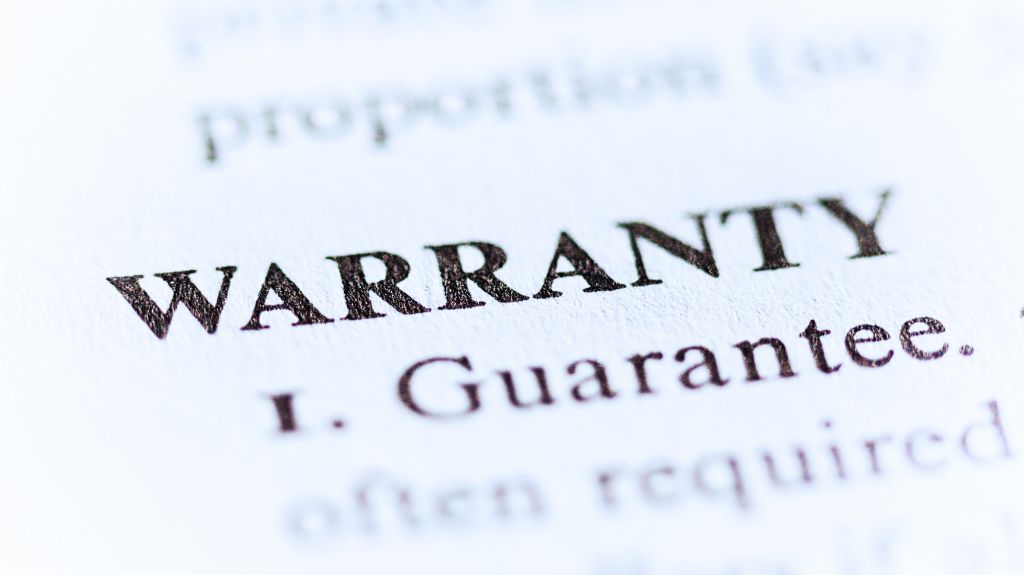 Close Up of Warranty Definition in Dictionary