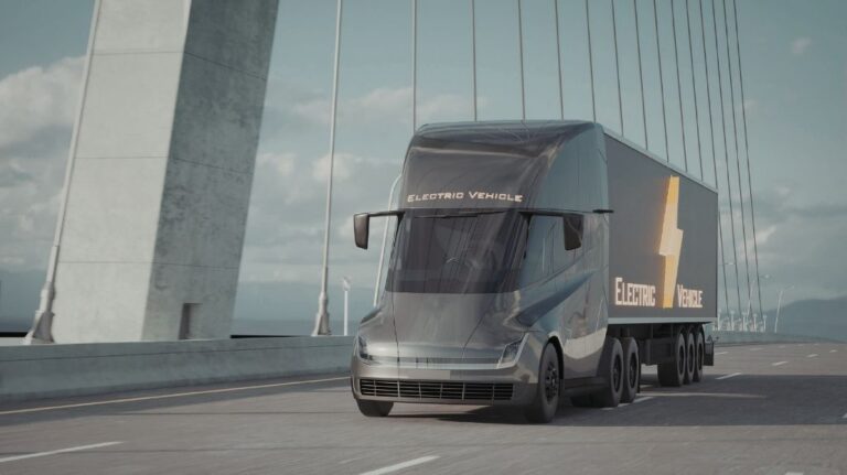 Gray Electric Semi Truck on a Bridge